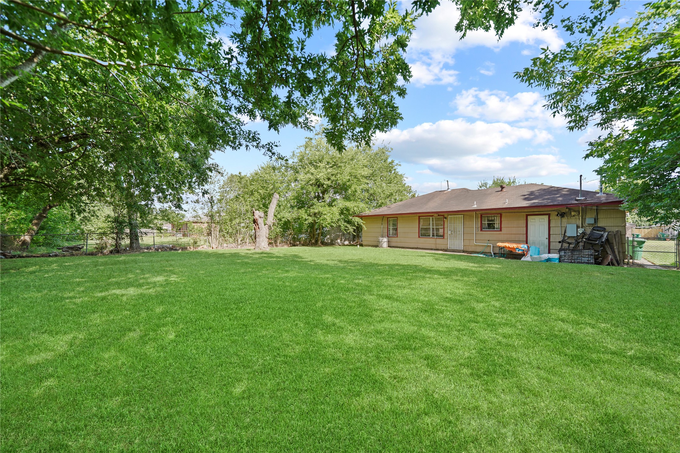 5631 Groveton Street Houston, TX 77033 - Photo 13 of 13 a front view of house with yard and trees