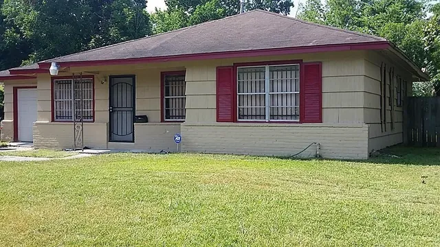 a house that has a big yard in front of it