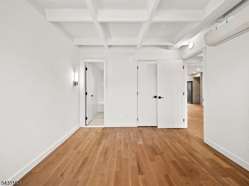 100 Chestnut Street, Unit 3 West Orange, NJ 07052 - Photo 10 of 18 a view of room with wooden floor