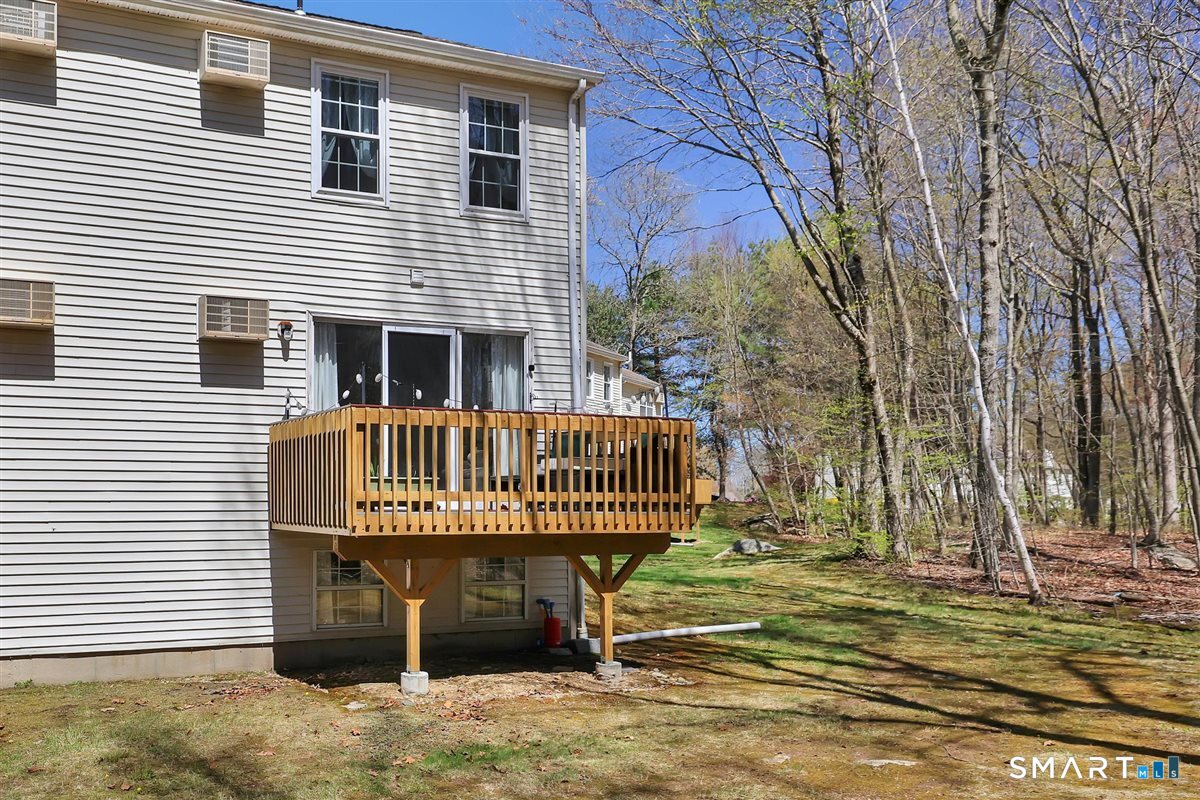 745 Merrow Road, Unit 136 Coventry, CT 06238 - Photo 3 of 21 Back of condo. Private deck