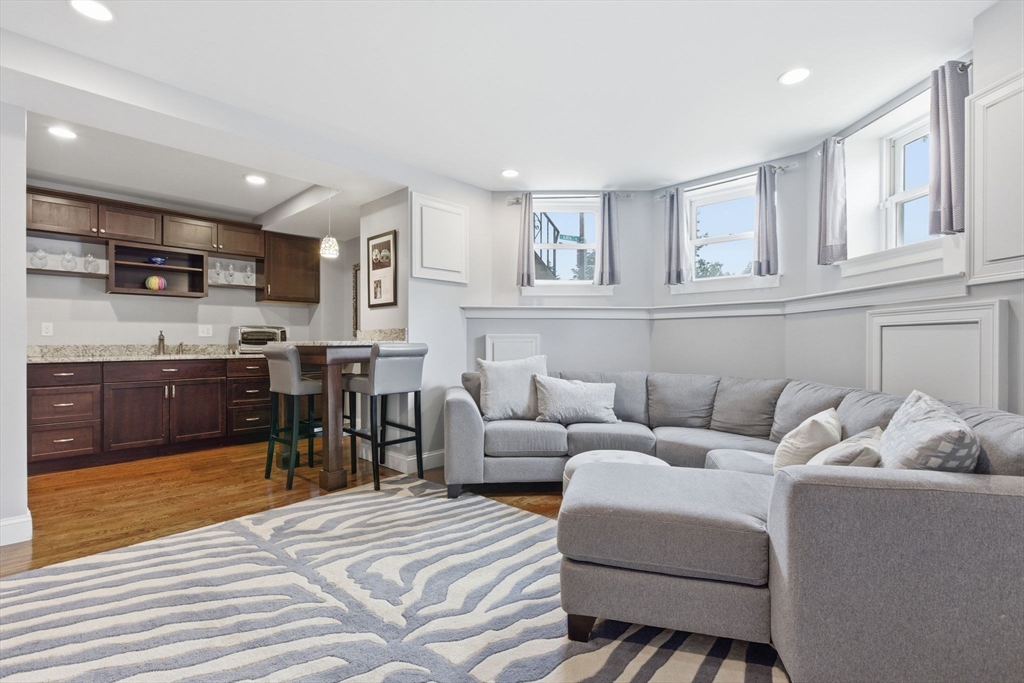 419 Main Street Boston, MA 02129 - Photo 28 of 41 a living room with furniture and kitchen view