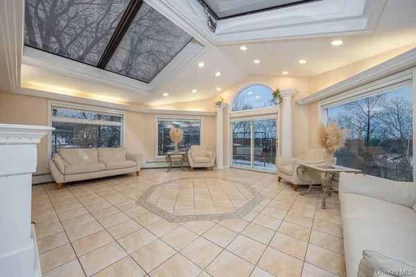 a view of a livingroom with furniture and a rug