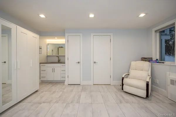 a living room with furniture and white walls