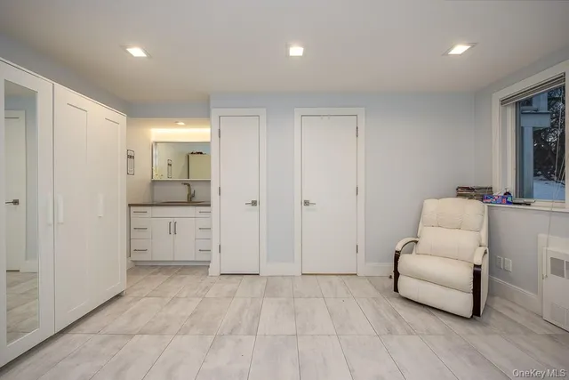 a living room with furniture and white walls