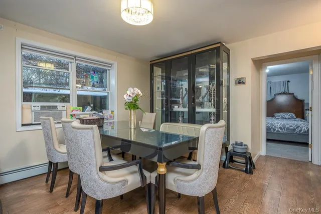 a dining room with furniture and window
