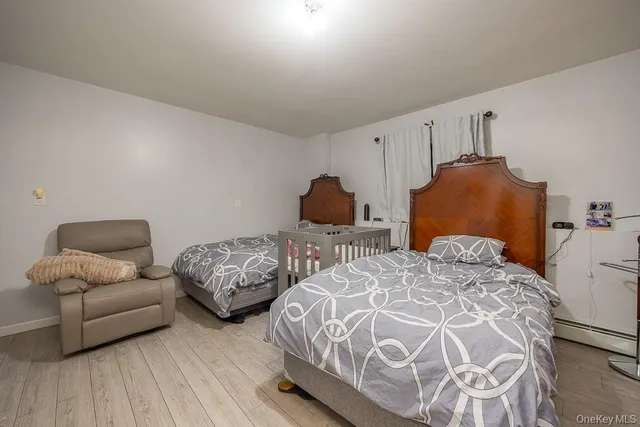 a bedroom with two beds and a couch