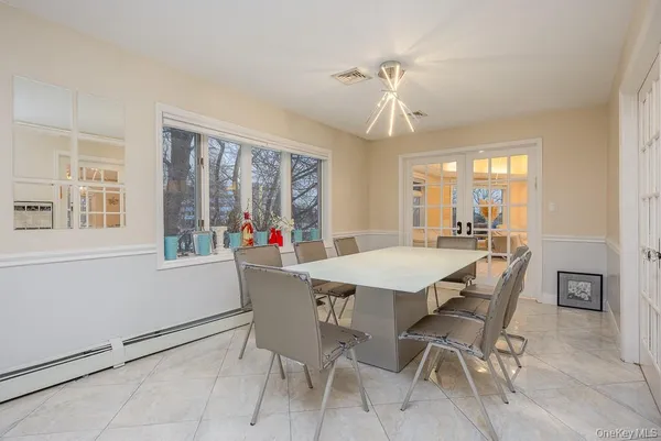 a view of a dining room with furniture window and outside view