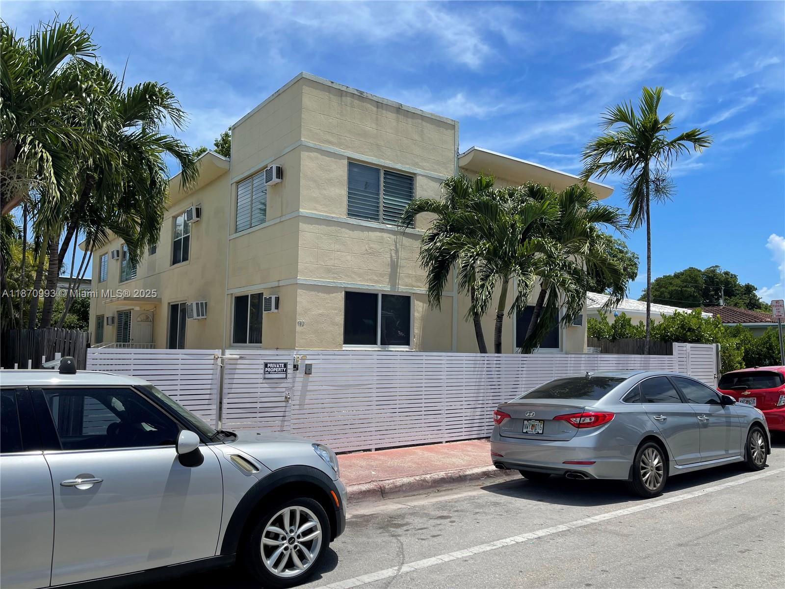 785 81st Street, Unit 3 Miami Beach, FL 33141 - Photo 1 of 12 a view of a car parked in front of a house