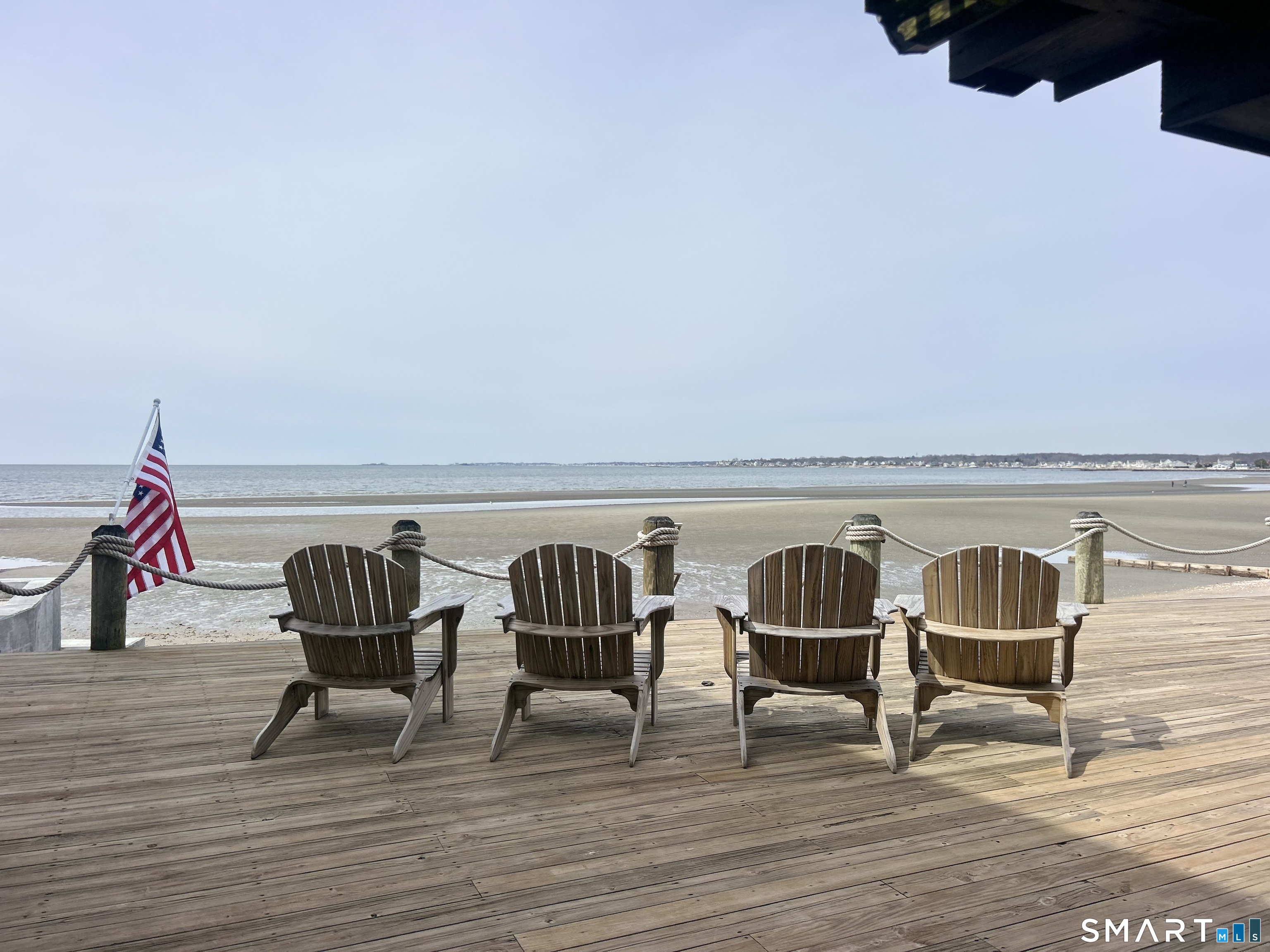 12 Toms Road Old Saybrook, CT 06475 - Photo 2 of 3 a view of chairs and table on wooden floor