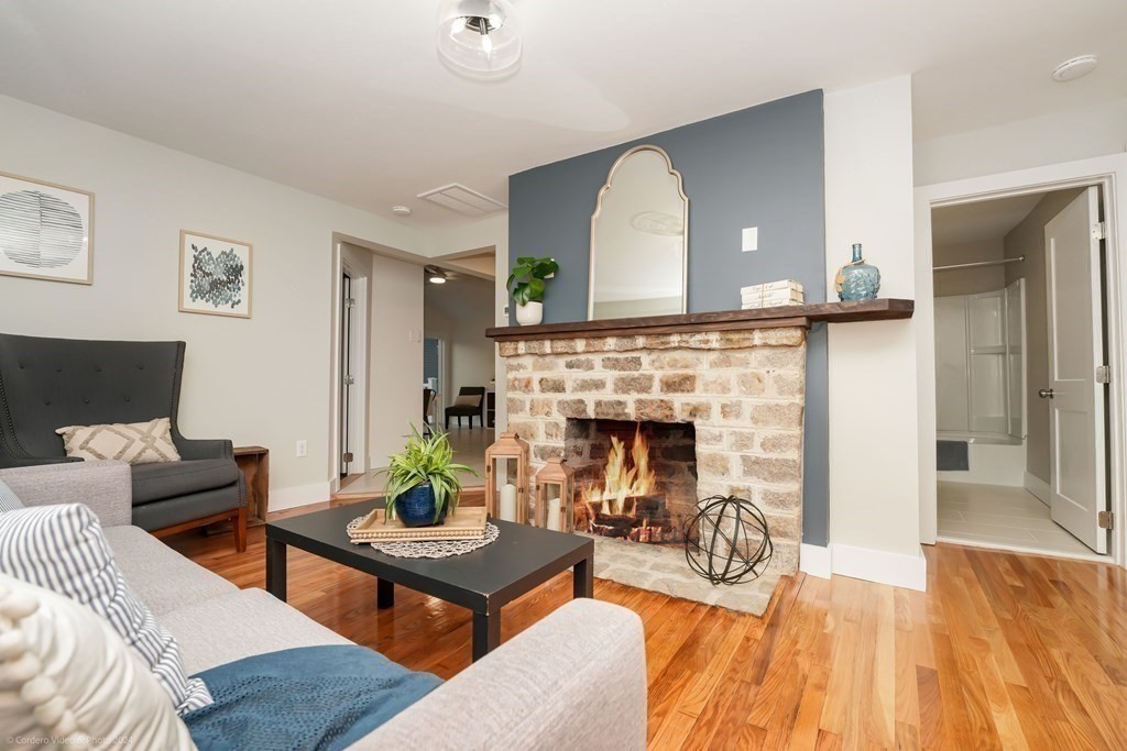 5 Harvard Street Fairhaven, MA 02719 - Photo 12 of 29 a living room with furniture and a fireplace
