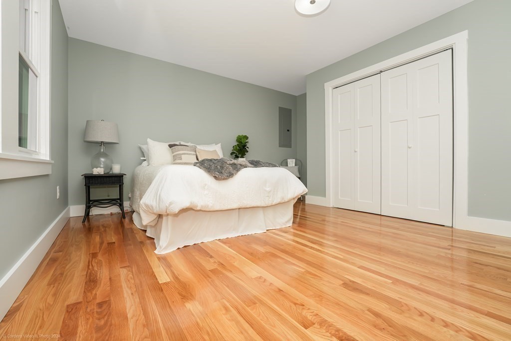 5 Harvard Street Fairhaven, MA 02719 - Photo 15 of 29 a bedroom with a bed and a table