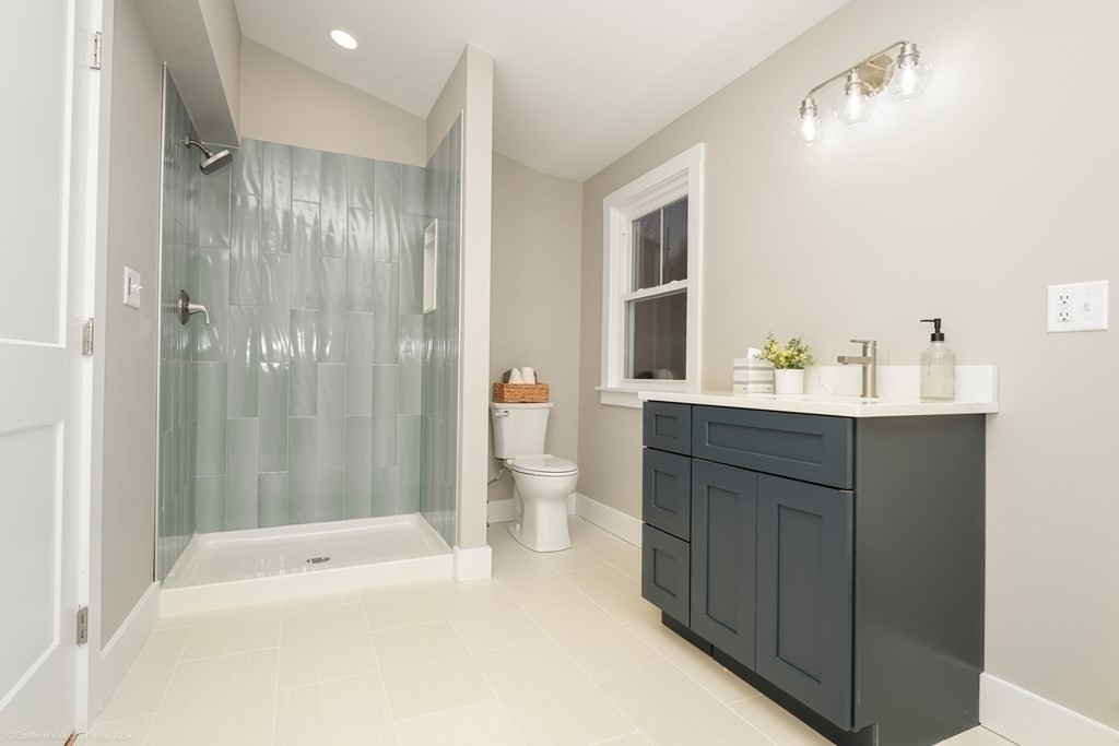 5 Harvard Street Fairhaven, MA 02719 - Photo 16 of 29 a bathroom with a sink double vanity and a bathtub