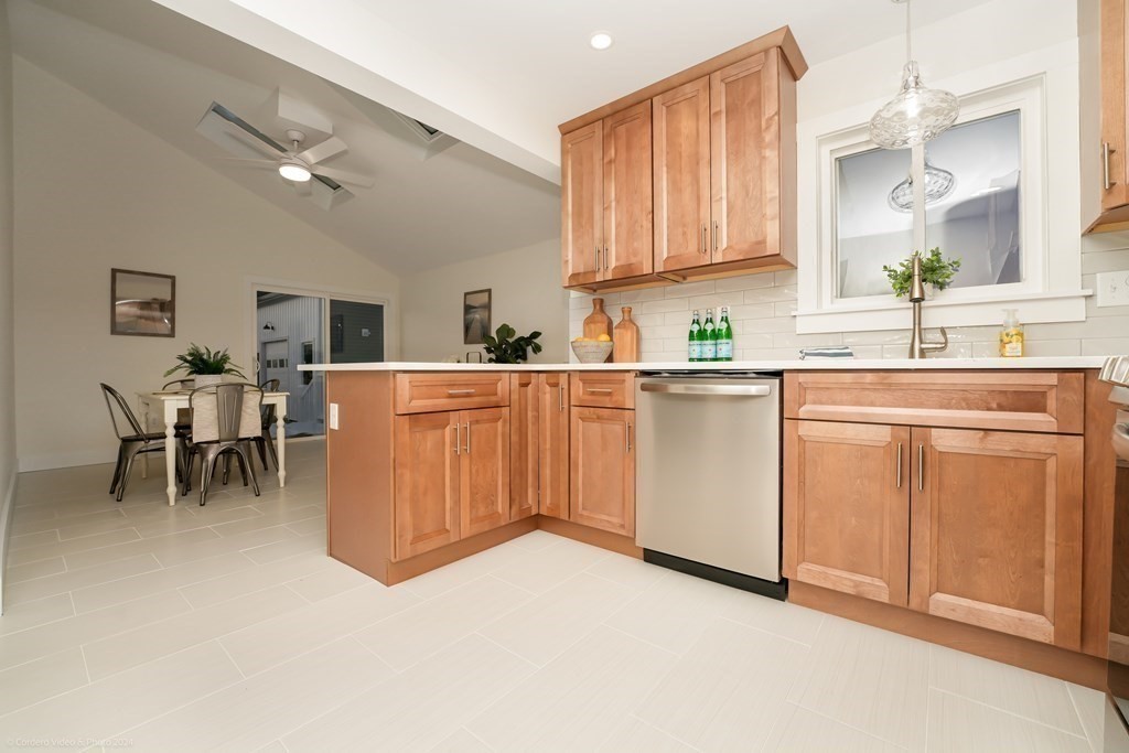 5 Harvard Street Fairhaven, MA 02719 - Photo 5 of 29 a kitchen with a sink and cabinets