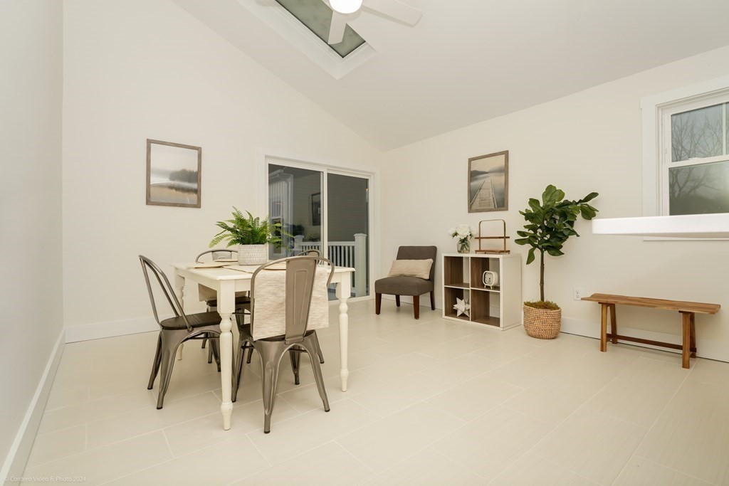 5 Harvard Street Fairhaven, MA 02719 - Photo 9 of 29 a dining room with furniture and potted plants