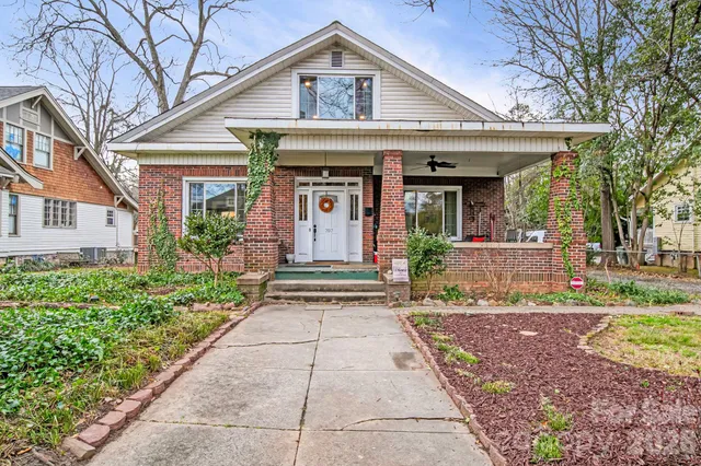 a front view of a house with a porch