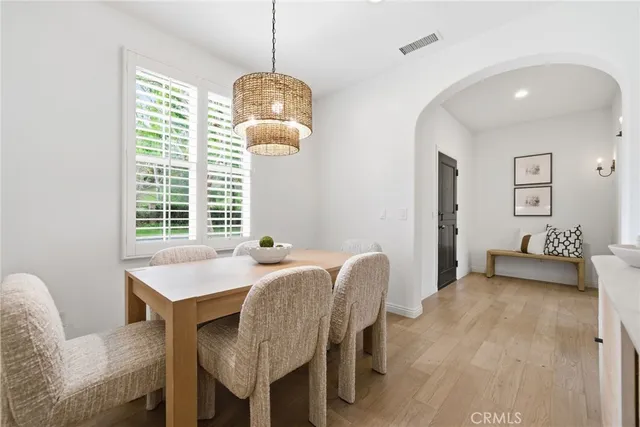 a bedroom with a bed and a lamp