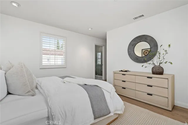 a bathroom with a granite countertop shower a toilet and a shower