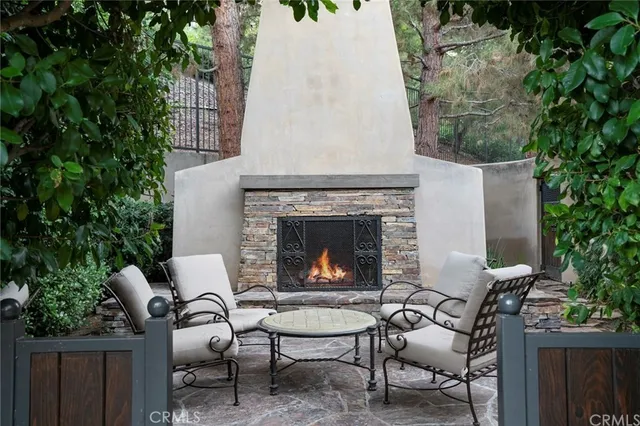 a living room with furniture a window and a fireplace