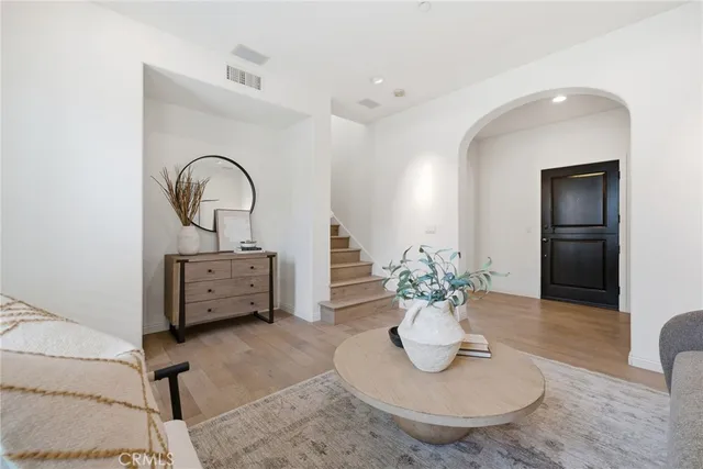 a kitchen with granite countertop wooden cabinets a refrigerator stove a sink and dishwasher