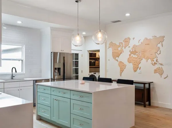 a bathroom with a sink and a large mirror