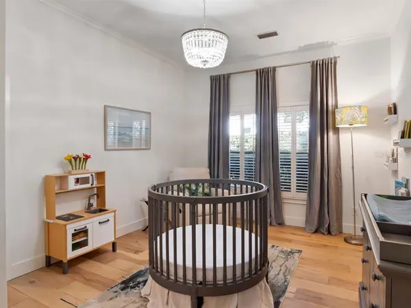 a bedroom with furniture and a window