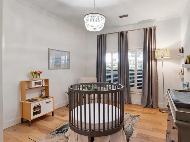 a bedroom with furniture and a window