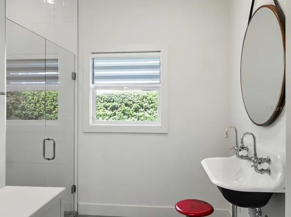 a bathroom with a sink and a mirror