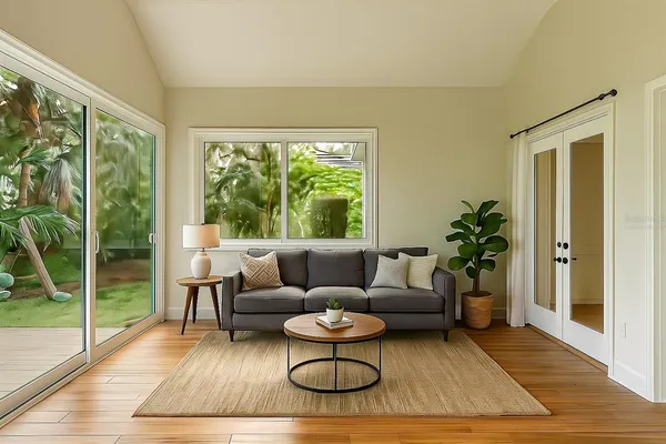 a living room with furniture and a large window