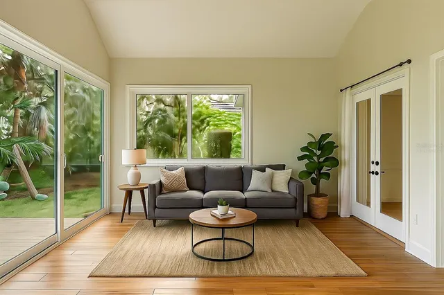 a living room with furniture and a large window
