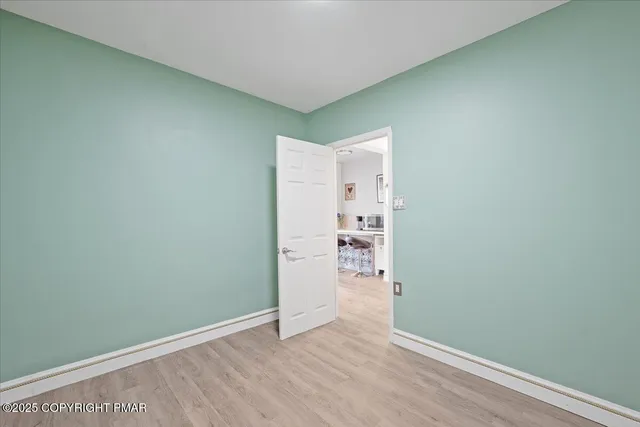 a dining room with furniture wooden floor and a potted plant