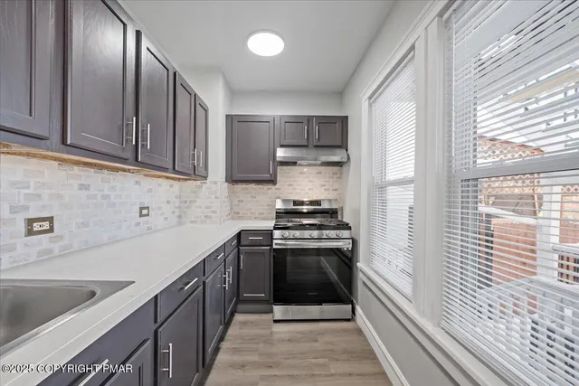 a view of a hallway with paintings on the wall