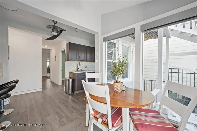 a view of a livingroom with furniture and wooden floor