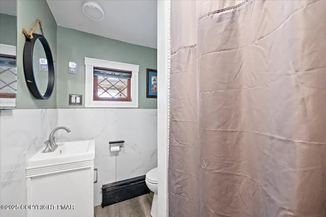 a kitchen with kitchen island a sink stove and refrigerator