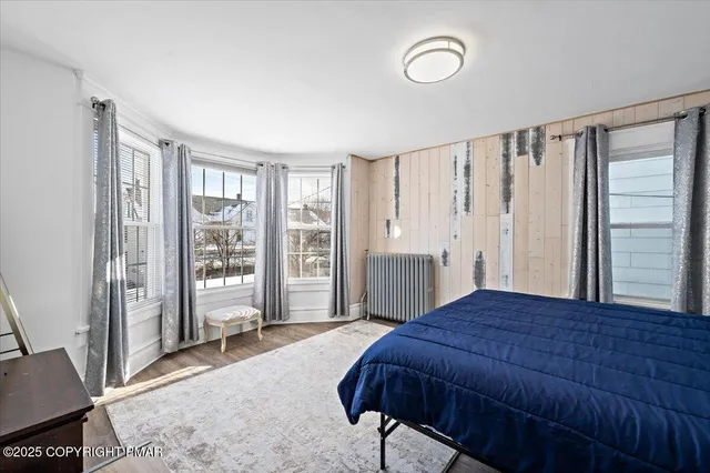 a view of a livingroom with furniture and a window