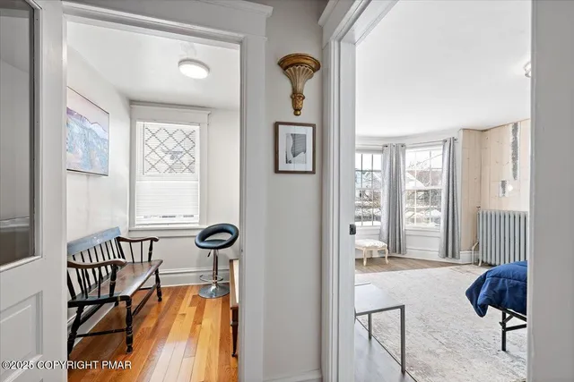 a bedroom with a bed and a desk