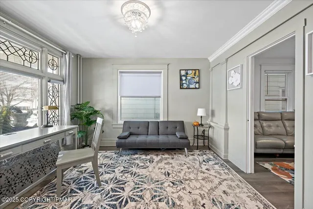 a bedroom with furniture and a rug