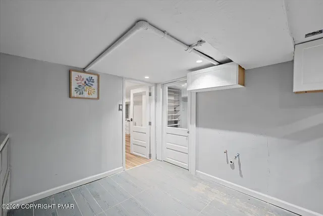 an aerial view of a house with swimming pool