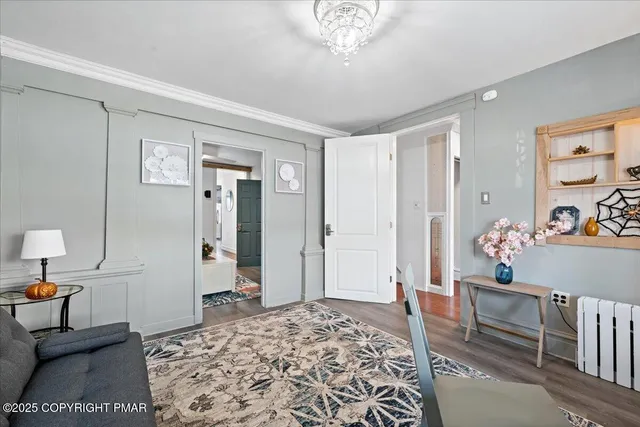 a room with a mirror and a dresser