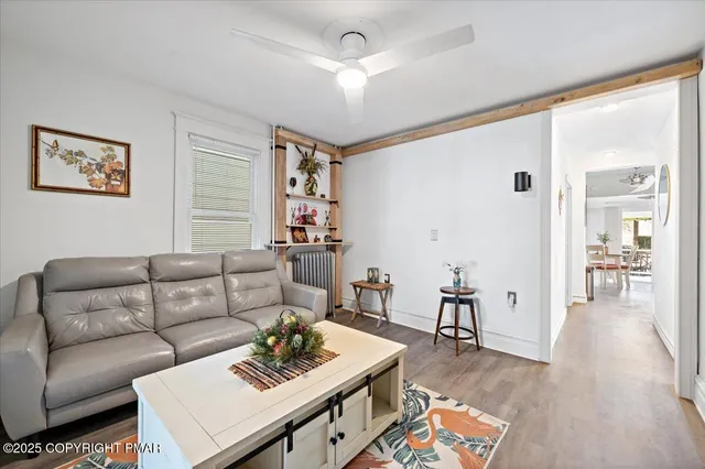 a white toilet sitting next to a shower