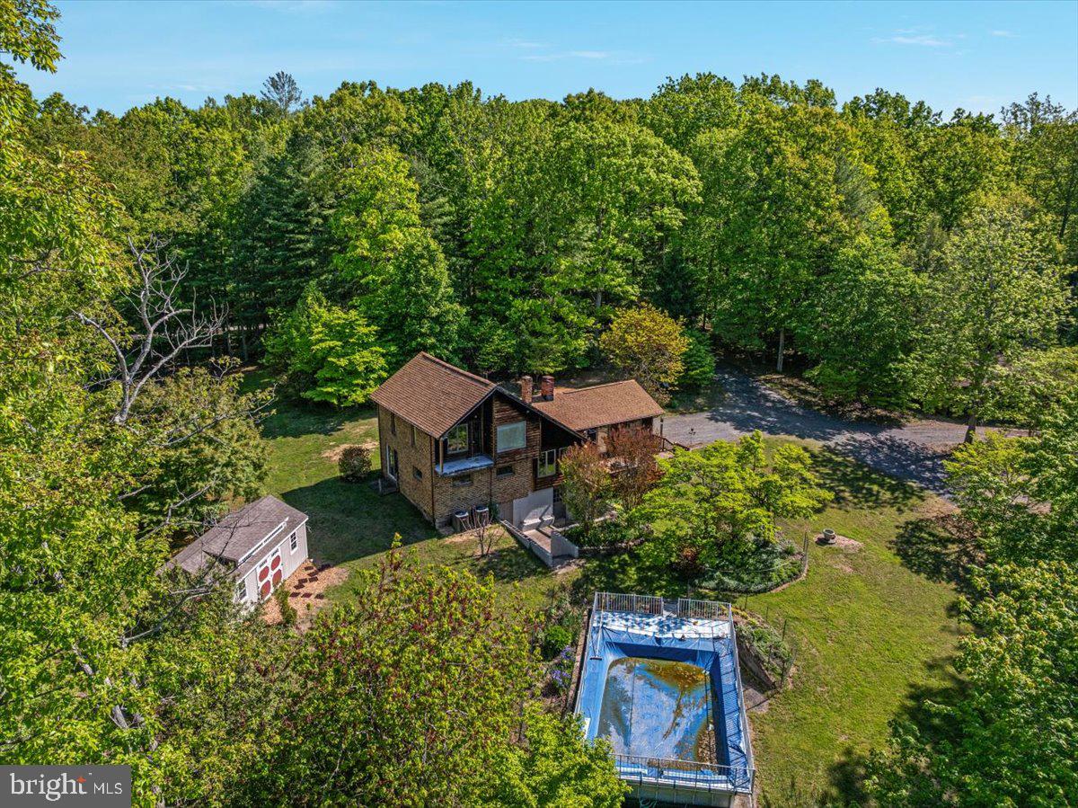 146 Lizzie Mills Road Castleton, VA 22716 - Photo 83 of 91 an aerial view of a house with swimming pool and garden