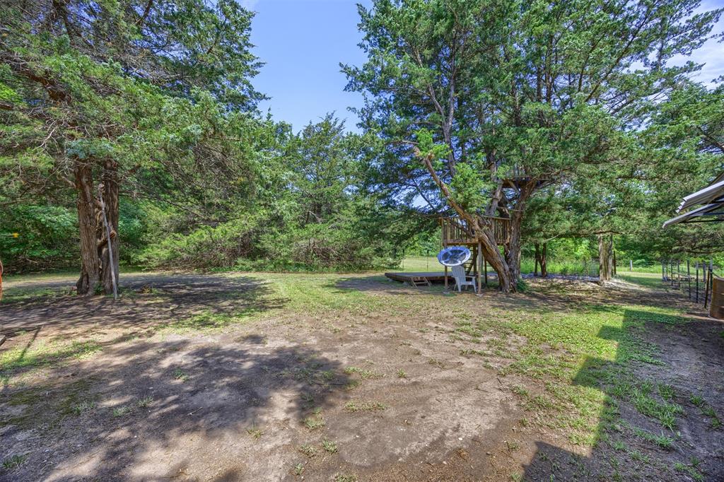 881 Wild Road Van Alstyne, TX 75495 - Photo 31 of 40 a view of backyard with green space