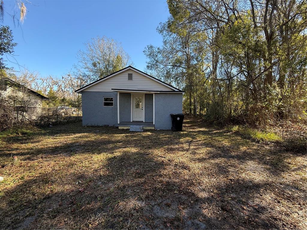 1205 Dell Street Starke, FL 32091 - Photo 10 of 12 a front view of a house with a yard