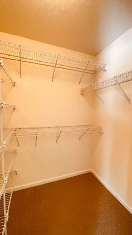 a bathroom with a large mirror and a toilet