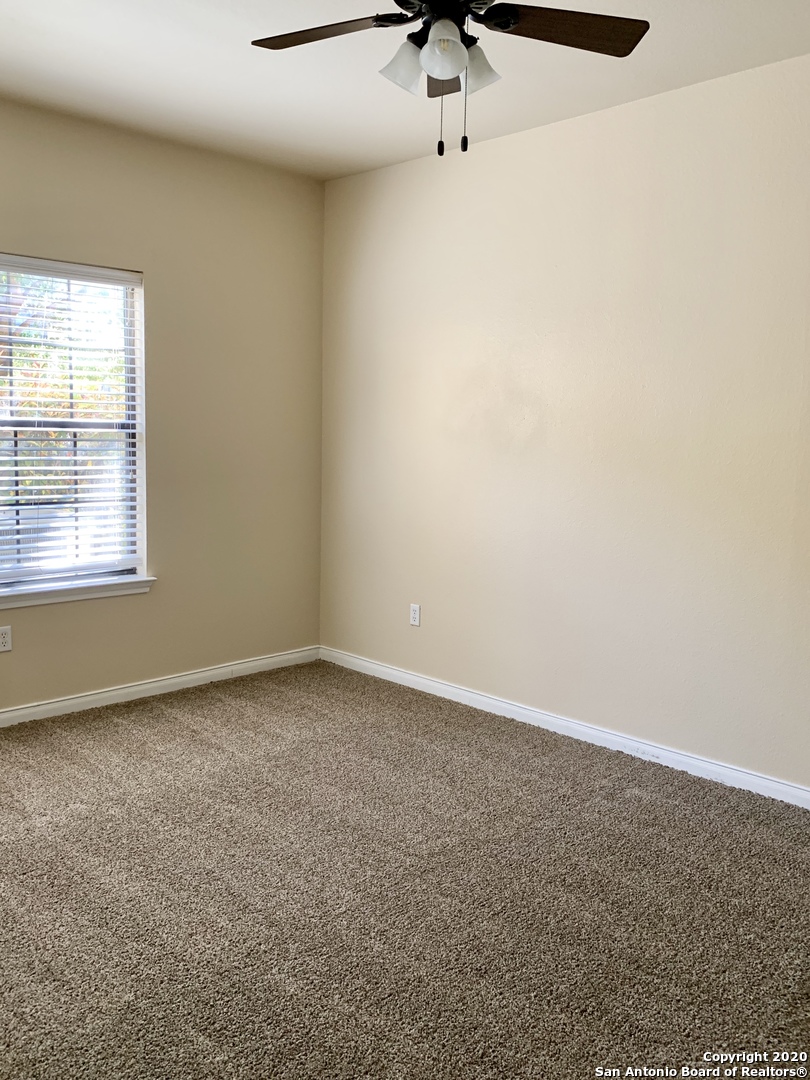 6160 Eckhert Road, Unit 505 San Antonio, TX 78240 - Photo 13 of 36 an empty room with a window
