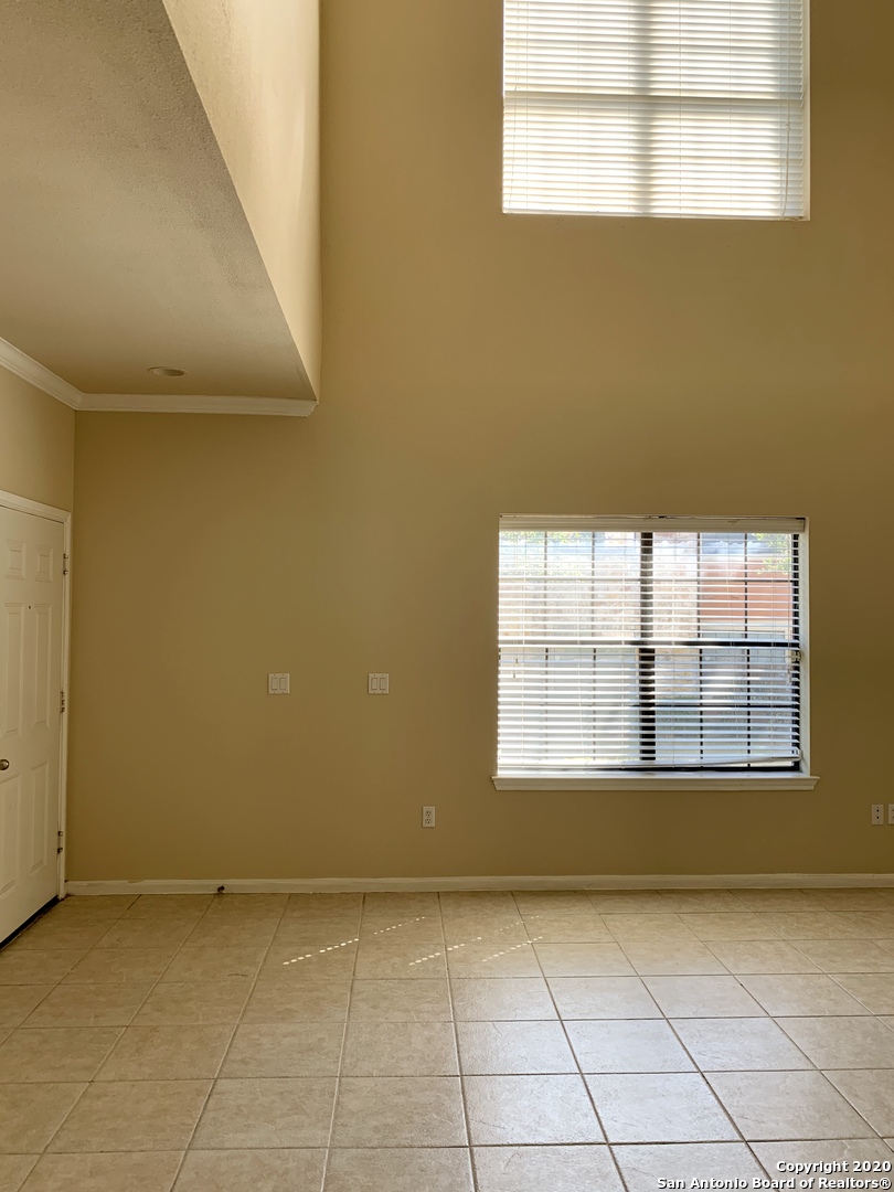 6160 Eckhert Road, Unit 505 San Antonio, TX 78240 - Photo 14 of 36 a view of an empty room with a window