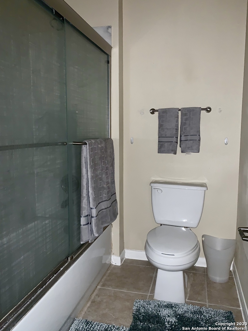 6160 Eckhert Road, Unit 505 San Antonio, TX 78240 - Photo 17 of 36 a bathroom with a toilet and a shower