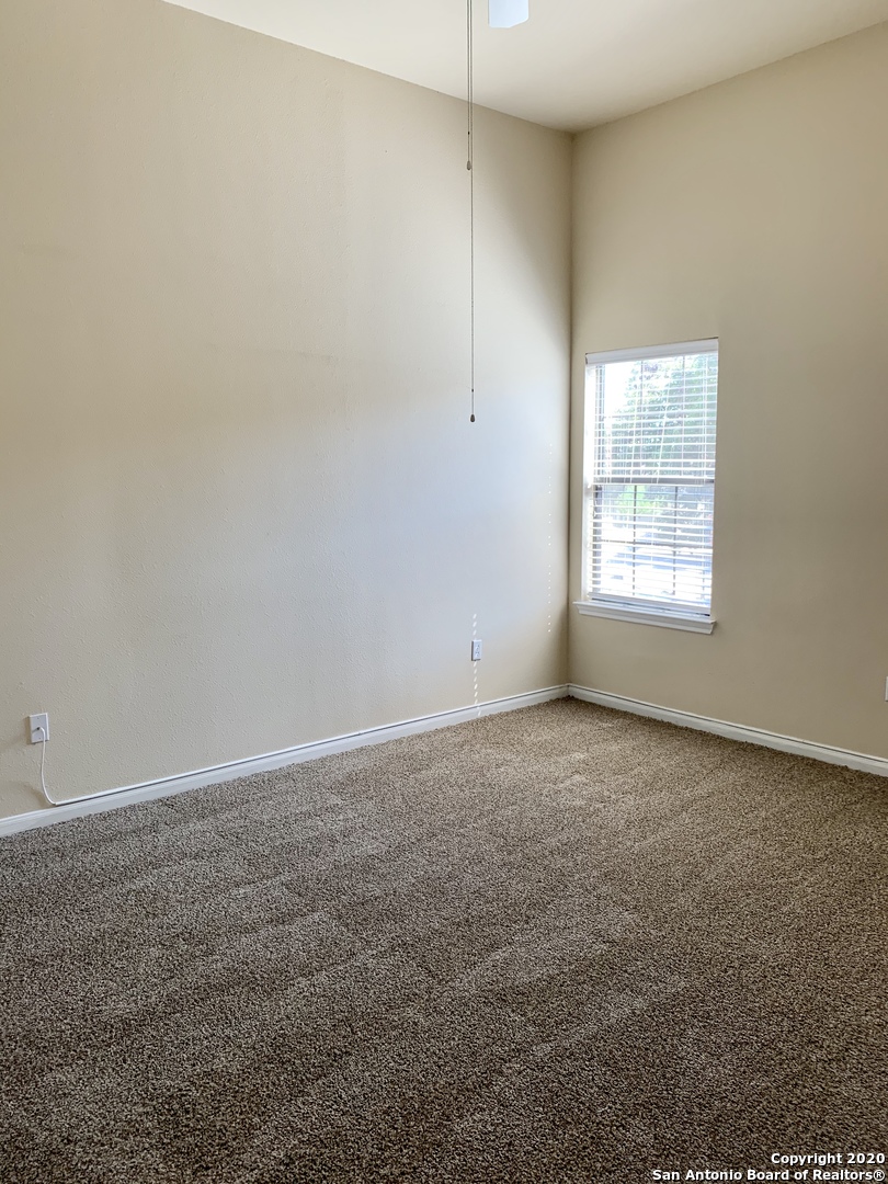 6160 Eckhert Road, Unit 505 San Antonio, TX 78240 - Photo 19 of 36 an empty room with a window