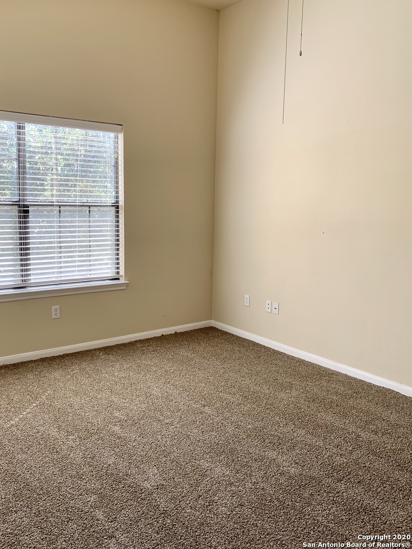 6160 Eckhert Road, Unit 505 San Antonio, TX 78240 - Photo 20 of 36 an empty room with a window