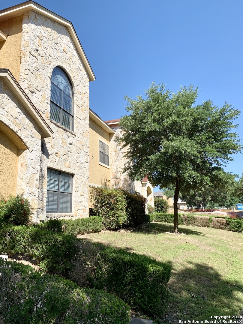 6160 Eckhert Road, Unit 505 San Antonio, TX 78240 - Photo 29 of 36 a front view of a house with garden