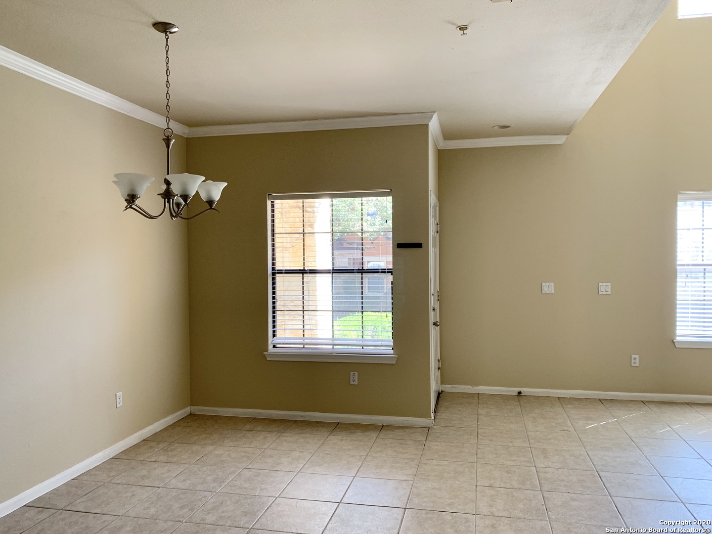 6160 Eckhert Road, Unit 505 San Antonio, TX 78240 - Photo 7 of 36 a view of a room with a window and chandelier